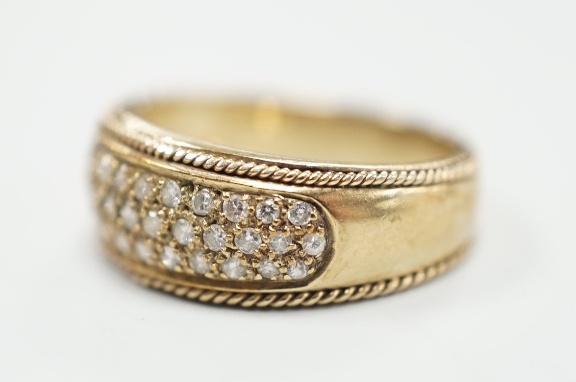 A modern 9ct gold and pave diamond chip set ring, size M/N, gross weight 4.5 grams.